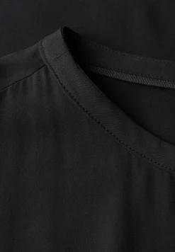 Bluse mit elastischem Saum