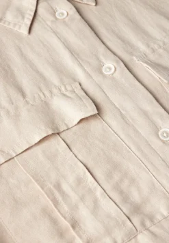 Bluse mit Knoten am Saum